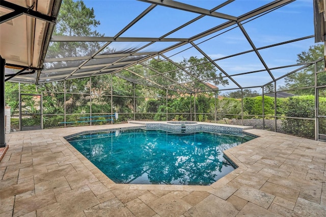 view of swimming pool featuring glass enclosure and a patio area