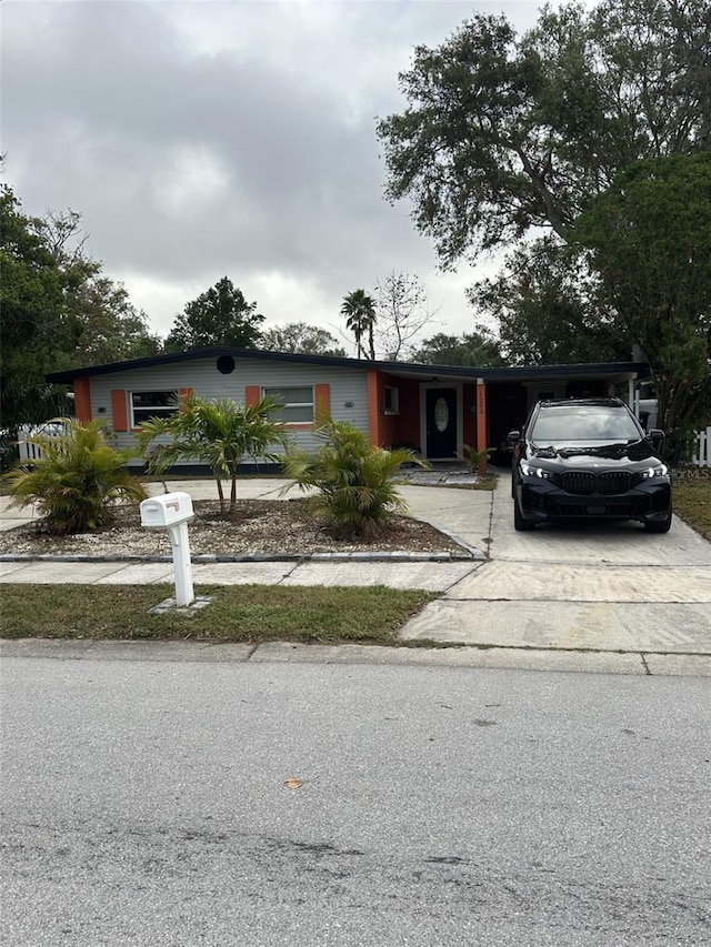 view of front facade with a carport