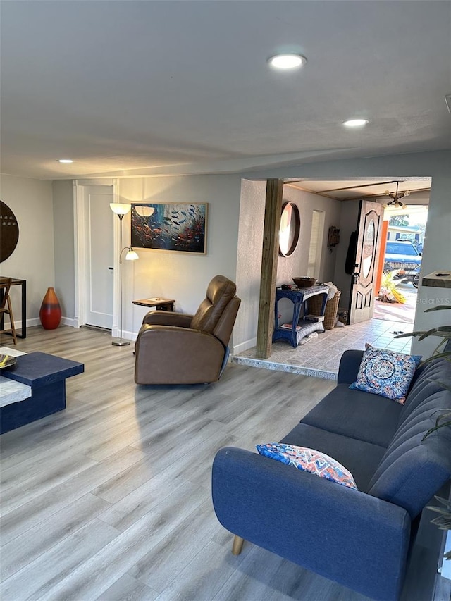 living room with light hardwood / wood-style flooring