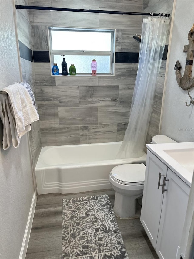 full bathroom with vanity, wood-type flooring, toilet, and shower / bathtub combination with curtain