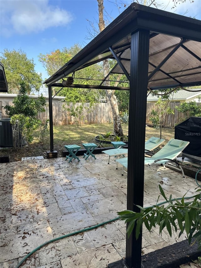 view of patio featuring a gazebo and cooling unit