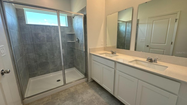 bathroom with tile patterned flooring, vanity, and an enclosed shower