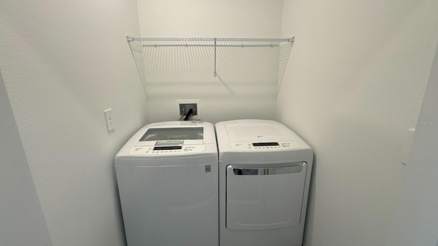 laundry area with washing machine and dryer