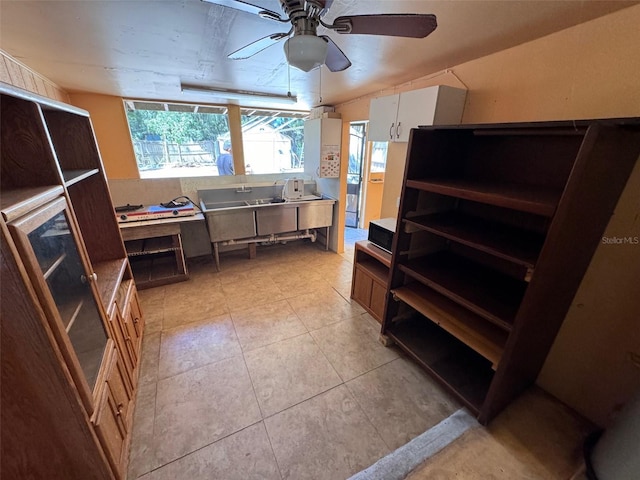 interior space featuring ceiling fan