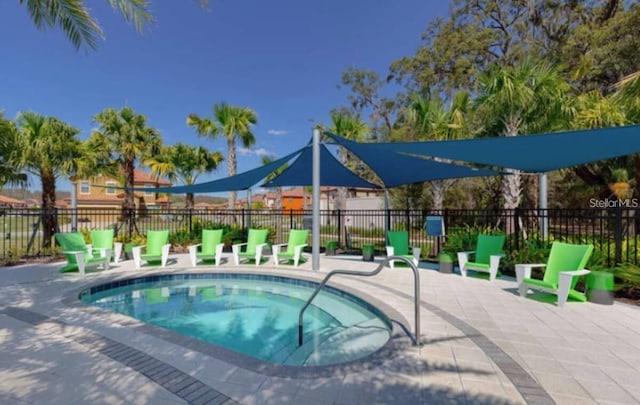 view of pool featuring a community hot tub