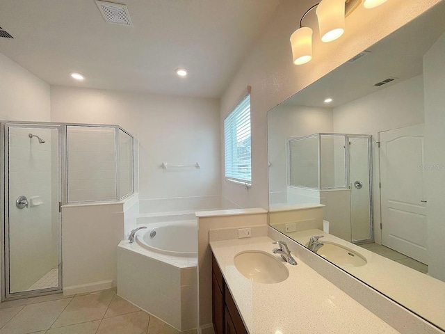 bathroom featuring tile patterned floors, vanity, and separate shower and tub