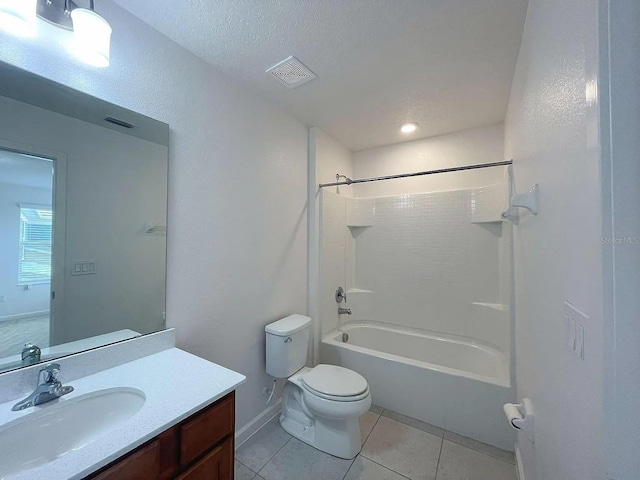 full bathroom with tile patterned floors, vanity, a textured ceiling, shower / tub combination, and toilet