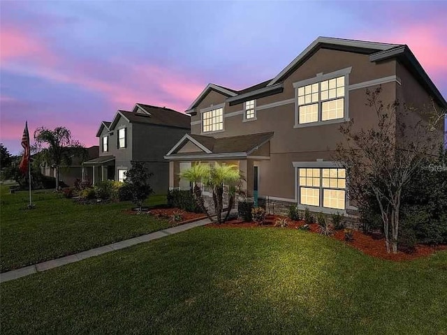 view of front of house with a lawn