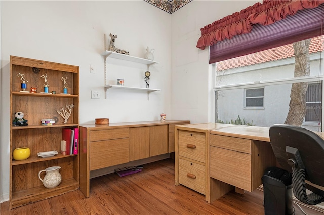 home office with wood finished floors