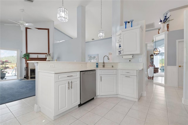 kitchen featuring light countertops, stainless steel dishwasher, open shelves, and a sink