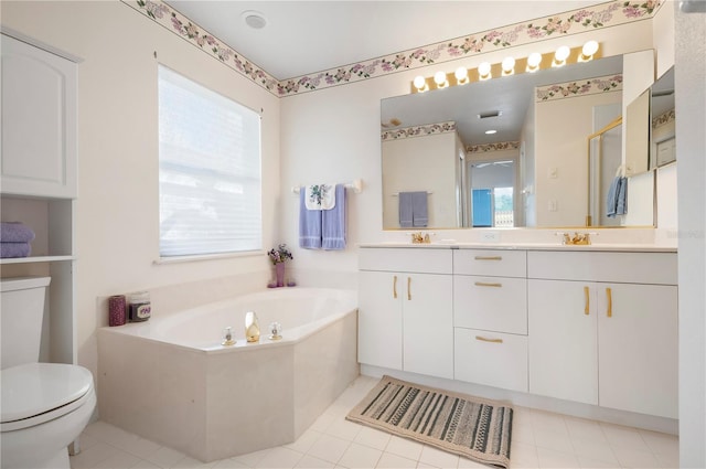 bathroom featuring a garden tub, toilet, a sink, a shower stall, and double vanity