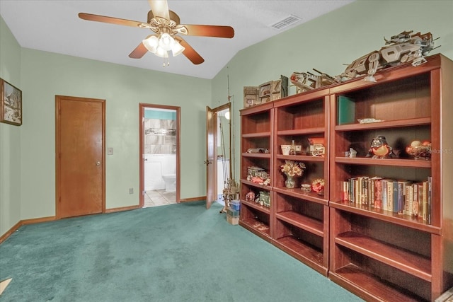 interior space featuring carpet, ceiling fan, and lofted ceiling