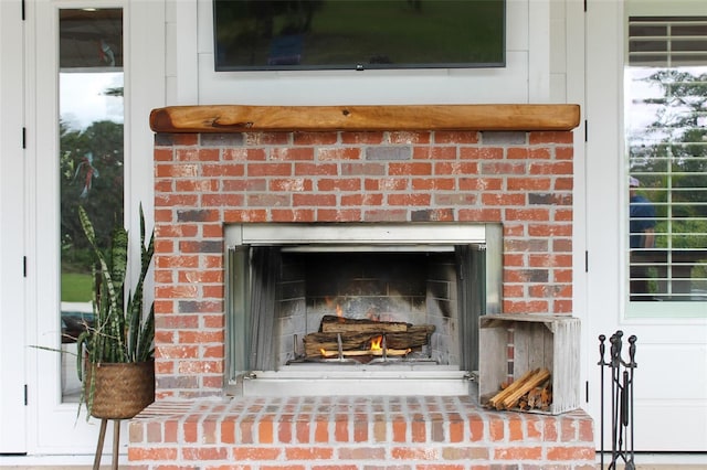 room details featuring a brick fireplace