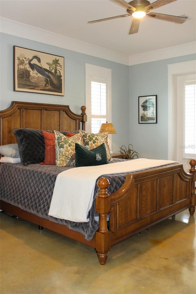 bedroom featuring multiple windows, ceiling fan, and ornamental molding