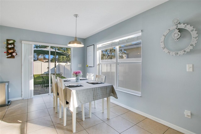 dining area with light tile patterned floors