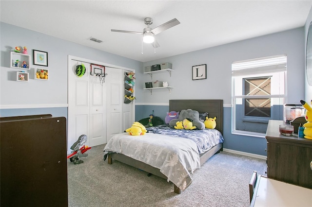 bedroom with carpet floors, a closet, and ceiling fan