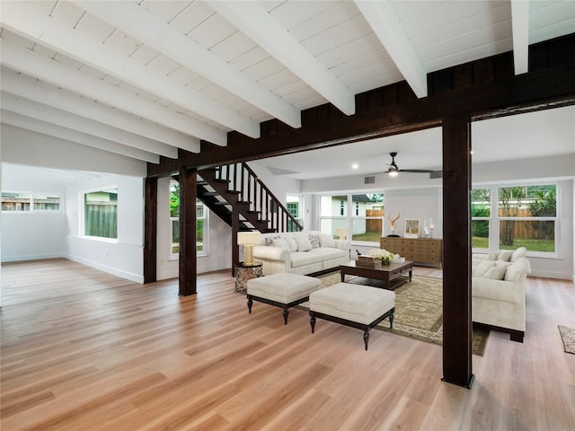 living room with ceiling fan, light hardwood / wood-style floors, wood ceiling, and lofted ceiling with beams