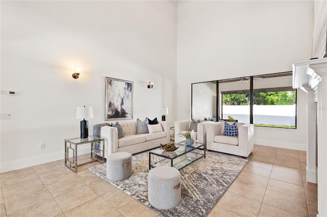 tiled living room with a towering ceiling