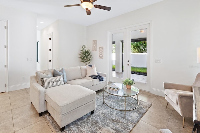 living room featuring ceiling fan, french doors, and light tile patterned floors