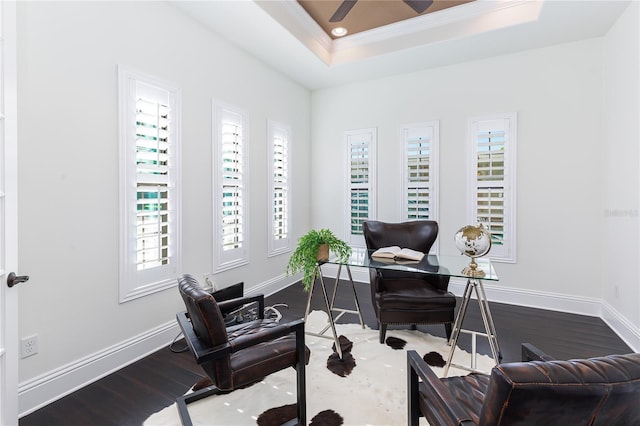 office with wood-type flooring, a tray ceiling, ceiling fan, and crown molding