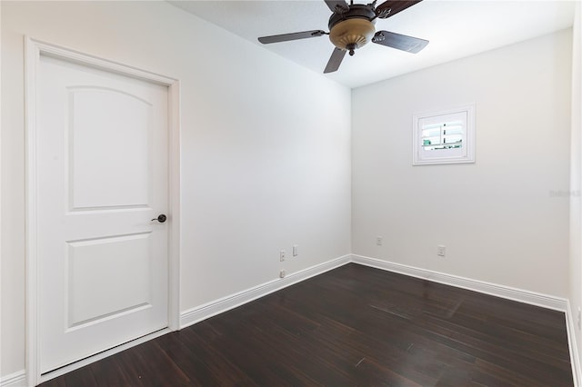 unfurnished room with ceiling fan and dark hardwood / wood-style floors