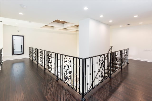 hall with beamed ceiling, dark wood-type flooring, and coffered ceiling