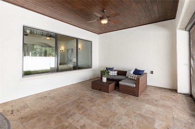 interior space with ceiling fan