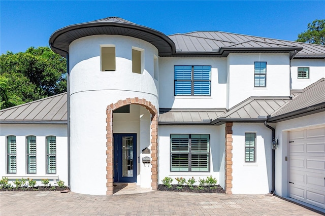 view of front of property with a garage