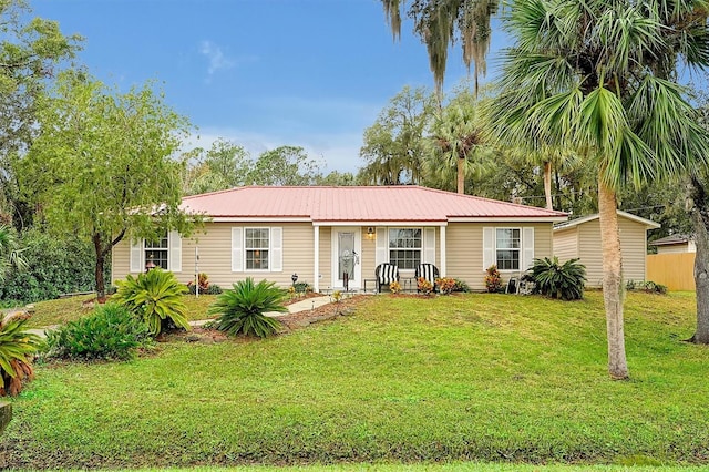 ranch-style home with a front lawn