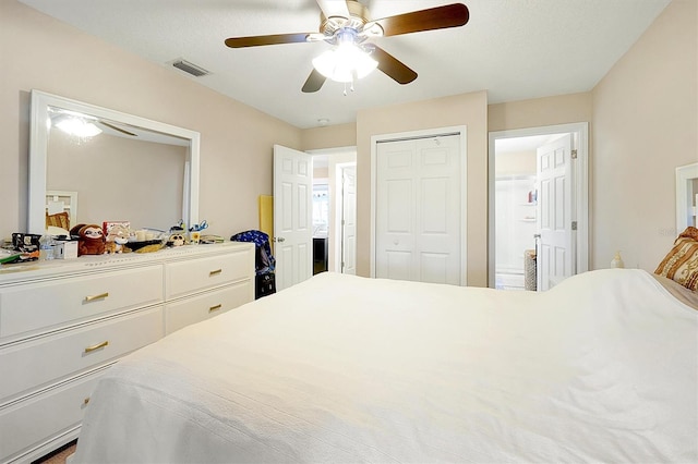 bedroom featuring ceiling fan and a textured ceiling