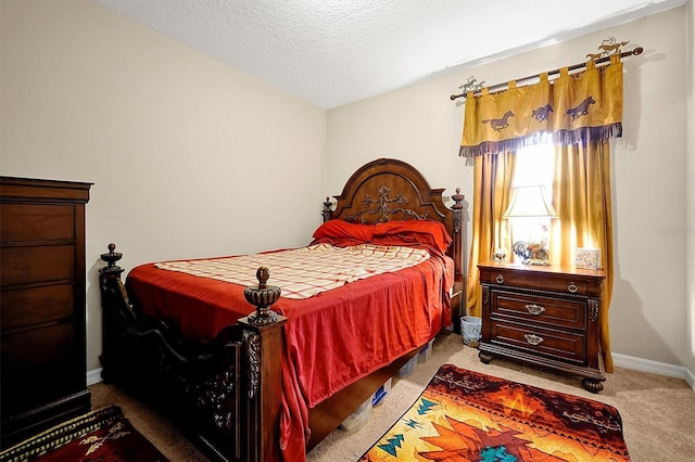 bedroom featuring carpet floors and a textured ceiling