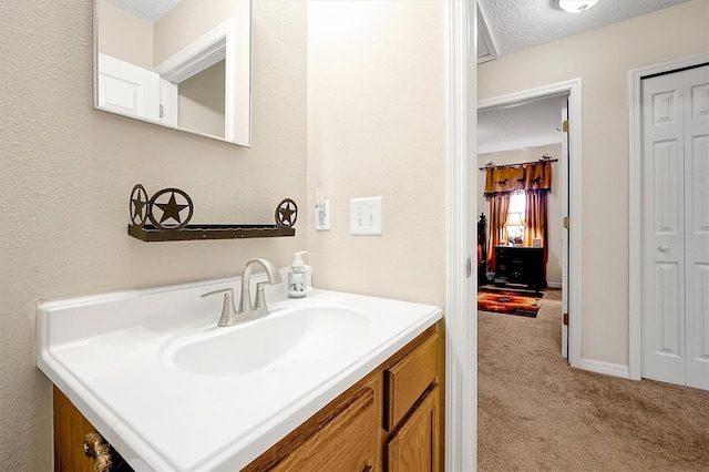 bathroom featuring vanity and a textured ceiling