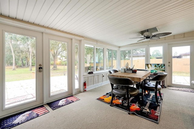 sunroom / solarium featuring ceiling fan