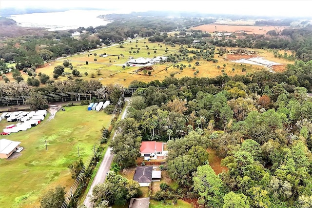 birds eye view of property with a rural view