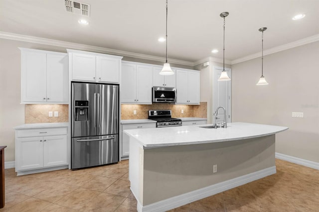 kitchen with sink, white cabinets, hanging light fixtures, and appliances with stainless steel finishes