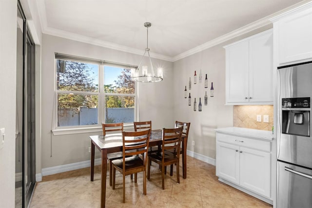 tiled dining area with ornamental molding and an inviting chandelier