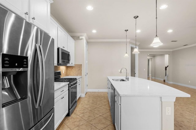 kitchen featuring appliances with stainless steel finishes, sink, pendant lighting, a center island with sink, and white cabinets