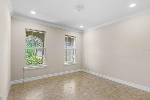 tiled spare room with ornamental molding