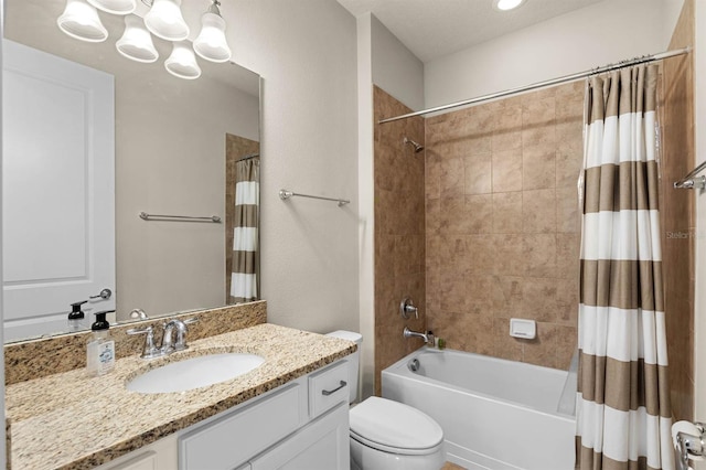 full bathroom featuring shower / tub combo, vanity, a textured ceiling, and toilet