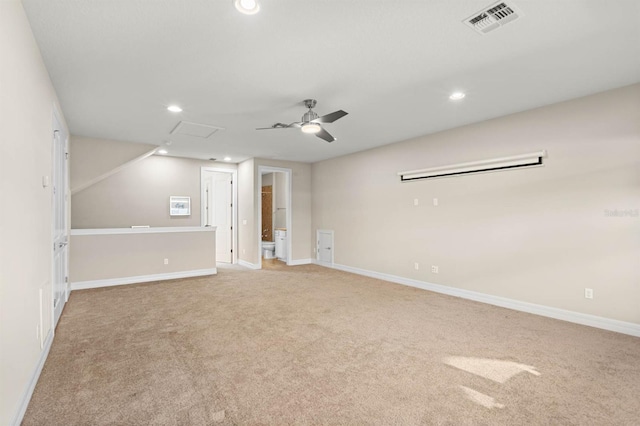 spare room with light carpet and ceiling fan