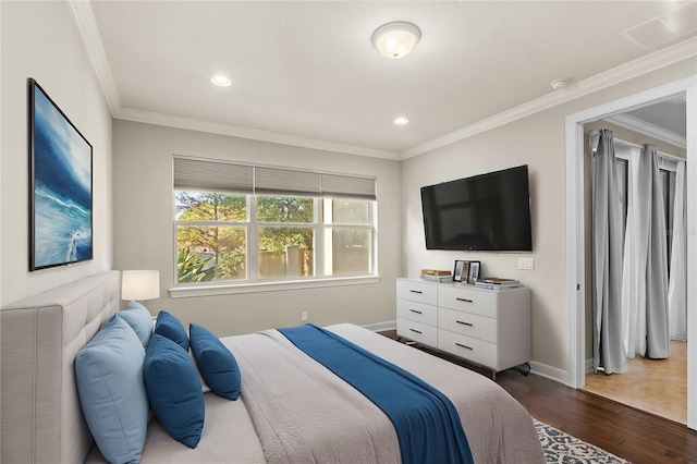 bedroom with ornamental molding and hardwood / wood-style flooring