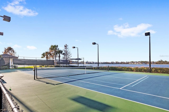 view of sport court featuring basketball hoop