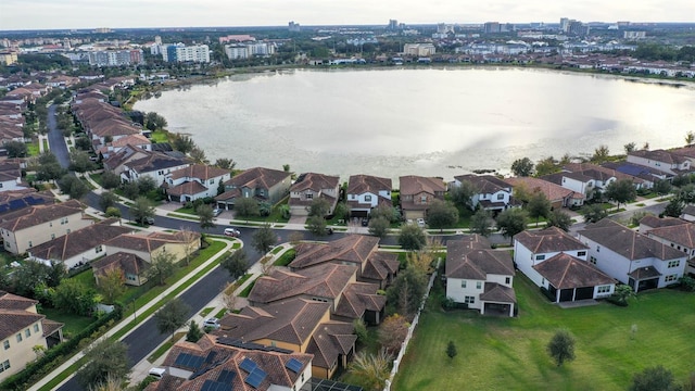 birds eye view of property with a water view