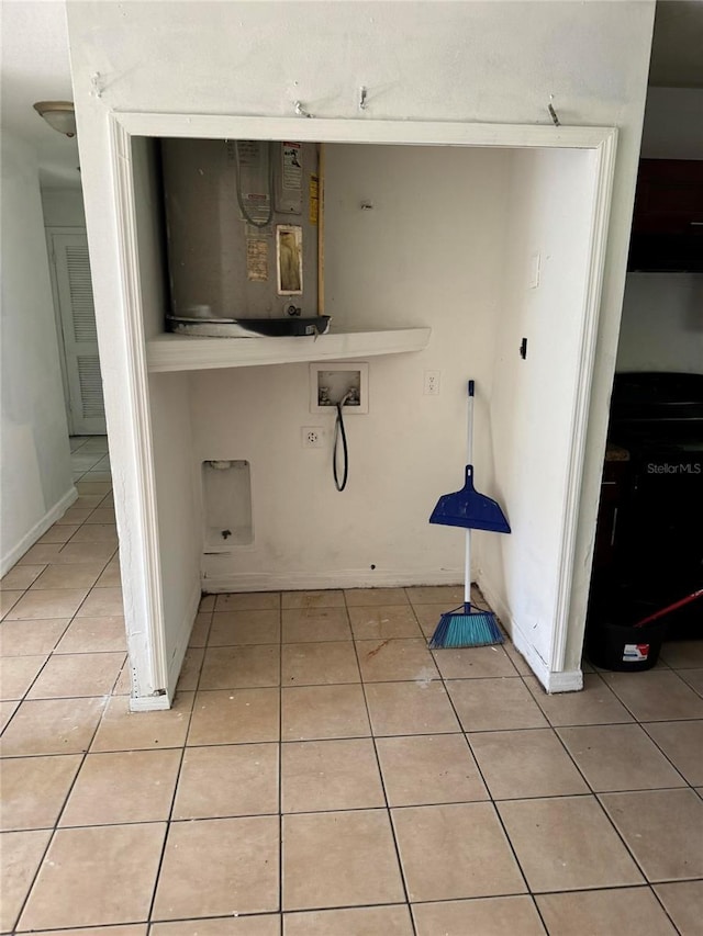 laundry area featuring light tile patterned floors and washer hookup