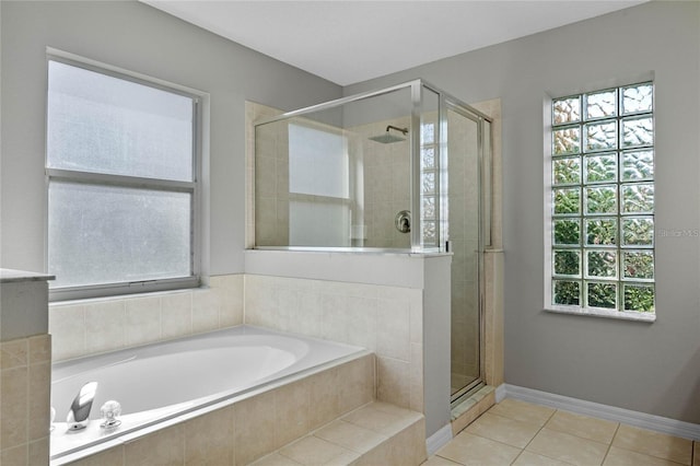 bathroom featuring separate shower and tub and tile patterned flooring