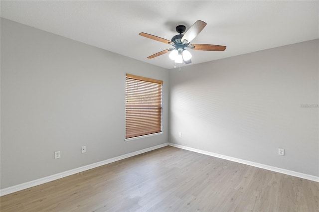 spare room featuring ceiling fan and light hardwood / wood-style flooring