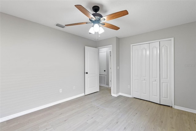 unfurnished bedroom featuring a closet, ceiling fan, and light hardwood / wood-style floors