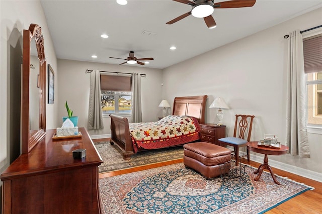 bedroom featuring ceiling fan and wood-type flooring