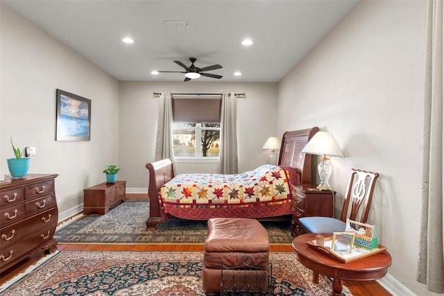 bedroom with hardwood / wood-style floors and ceiling fan