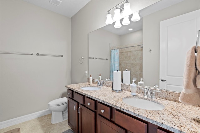 bathroom with tile patterned flooring, vanity, toilet, and curtained shower